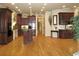 Bright, spacious kitchen with island, stainless appliances, hardwood floors, and custom wood cabinetry at 154 Gold Leaf Trail Trl, Powder Springs, GA 30127