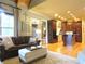 Open concept living room with hardwood floors, recessed lighting, and custom cabinetry at 154 Gold Leaf Trail Trl, Powder Springs, GA 30127