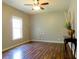 Sun-filled living room with hardwood floors and large window, offering a modern and inviting space at 154 Gold Leaf Trail Trl, Powder Springs, GA 30127