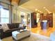 Open concept living room with hardwood floors and dark wood kitchen cabinets at 154 Gold Leaf Trail Trl, Powder Springs, GA 30127