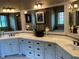 Spacious bathroom with double vanity sinks, granite countertops, and decorative mirrors and light fixtures at 154 Gold Leaf Trail Trl, Powder Springs, GA 30127