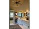 Beautiful main bathroom with double vanity, granite countertops, and decorative mirrors and light fixtures at 154 Gold Leaf Trail Trl, Powder Springs, GA 30127
