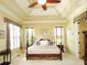 Elegant main bedroom with natural light, tray ceiling, and attractive window treatments at 154 Gold Leaf Trail Trl, Powder Springs, GA 30127