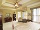 Well-lit main bedroom with comfortable seating area, plenty of natural light, and cozy furnishings at 154 Gold Leaf Trail Trl, Powder Springs, GA 30127