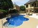 Beautiful outdoor pool area featuring patio and stone accents at 154 Gold Leaf Trail Trl, Powder Springs, GA 30127