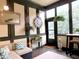 Cozy sunroom with patterned paneling, tile flooring, and lots of natural light at 154 Gold Leaf Trail Trl, Powder Springs, GA 30127