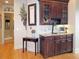 Wet bar features dark wood cabinetry, granite countertops and tiled backsplash at 154 Gold Leaf Trail Trl, Powder Springs, GA 30127