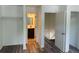 Bedroom view with wood-look floors, showing access to bathroom and closet spaces at 6662 Witherington Ct, Norcross, GA 30093