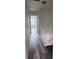 Hallway with hardwood floors leading to bedrooms and access to attic at 6662 Witherington Ct, Norcross, GA 30093
