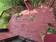Wooden back deck surrounded by greenery, offering an inviting space for outdoor relaxation at 964 Glynn Oaks Dr, Clarkston, GA 30021