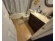 Compact bathroom featuring a shower over tub, toilet, and vanity with storage at 964 Glynn Oaks Dr, Clarkston, GA 30021