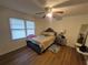 Bright bedroom with a cozy bed, bedside table, and modern flooring, bathed in natural light at 964 Glynn Oaks Dr, Clarkston, GA 30021