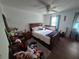 Spacious bedroom featuring natural light, a ceiling fan, and a comfortable-looking bed at 964 Glynn Oaks Dr, Clarkston, GA 30021