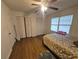 Bright bedroom with dual closets, wood-look floors, and a comfortable bed at 964 Glynn Oaks Dr, Clarkston, GA 30021