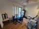 Cozy dining area featuring a table with chairs, and natural light from the door to the outside at 964 Glynn Oaks Dr, Clarkston, GA 30021