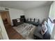 Inviting living room with hardwood floors, a modern rug, and comfortable seating arrangement at 964 Glynn Oaks Dr, Clarkston, GA 30021