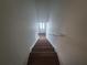 Clean stairwell leading to the upper level of the home at 964 Glynn Oaks Dr, Clarkston, GA 30021