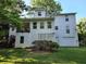 Back of house with deck, walkout basement, and large yard at 3054 Whisper Knob Rd, Marietta, GA 30062