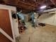 Spacious unfinished basement with water heater, shelves, and workbench at 3054 Whisper Knob Rd, Marietta, GA 30062