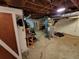 Basement featuring concrete floor, water heater, exposed ceiling, workbench, and storage at 3054 Whisper Knob Rd, Marietta, GA 30062