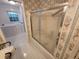 Bathroom with floral wallpaper, a walk-in tub, and a glass shower door at 3054 Whisper Knob Rd, Marietta, GA 30062