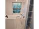 Bathroom featuring a walk-in tub and white tile at 3054 Whisper Knob Rd, Marietta, GA 30062