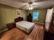 Bedroom featuring hardwood floors, a ceiling fan, and neutral-colored walls at 3054 Whisper Knob Rd, Marietta, GA 30062