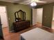Spacious bedroom featuring wood floors and a ceiling fan at 3054 Whisper Knob Rd, Marietta, GA 30062