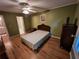 Bedroom with hardwood floors, a ceiling fan, and neutral-colored walls at 3054 Whisper Knob Rd, Marietta, GA 30062