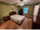 Bedroom with wood-look floors, a ceiling fan, and a window at 3054 Whisper Knob Rd, Marietta, GA 30062