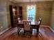 Cozy dining room with hardwood floors, traditional furniture, and natural light at 3054 Whisper Knob Rd, Marietta, GA 30062