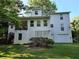 Back exterior of home with deck, stairs, garage, and yard at 3054 Whisper Knob Rd, Marietta, GA 30062