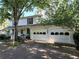 Charming two-story home with a white exterior, attached garage, and a welcoming front porch at 3054 Whisper Knob Rd, Marietta, GA 30062