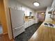 Functional kitchen featuring white appliances and wood countertops at 3054 Whisper Knob Rd, Marietta, GA 30062