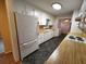 Bright kitchen with ample cabinet space, wood countertops, and a seamless flow into the breakfast nook at 3054 Whisper Knob Rd, Marietta, GA 30062