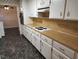 Functional kitchen area with light-colored cabinets, neutral countertops, and modern appliances at 3054 Whisper Knob Rd, Marietta, GA 30062
