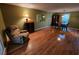 Cozy living room featuring gleaming hardwood floors and comfortable seating at 3054 Whisper Knob Rd, Marietta, GA 30062