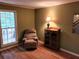 Comfortable living room featuring a recliner, hardwood floors, and a window at 3054 Whisper Knob Rd, Marietta, GA 30062