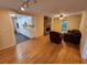 Open concept living room adjacent to kitchen with stone fireplace and lots of natural light at 3054 Whisper Knob Rd, Marietta, GA 30062