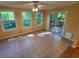 Sun-filled room with ceramic tile flooring, lots of windows, and a sliding door to the outdoor patio at 3054 Whisper Knob Rd, Marietta, GA 30062