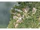 A birdseye view displays multiple houses with docks, nestled in a community along the lake at 307 Little Hickory Ln, Woodstock, GA 30189