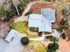 Aerial view of the property with the house, shed, and landscaped yard at 307 Little Hickory Ln, Woodstock, GA 30189