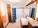 Neutral bathroom with shower-tub combination, classic cabinetry and fixtures at 307 Little Hickory Ln, Woodstock, GA 30189