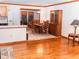 Open concept dining room with wood floors, view to the living room and kitchen at 307 Little Hickory Ln, Woodstock, GA 30189