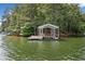 Dock situated on the calm waters provides the perfect spot for relaxation and lake access at 307 Little Hickory Ln, Woodstock, GA 30189