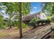 Back view of the home featuring an elevated deck and steps down to the yard at 307 Little Hickory Ln, Woodstock, GA 30189