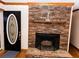 Living room view showcasing the stone fireplace and decorative front door at 307 Little Hickory Ln, Woodstock, GA 30189