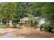 Ranch house with a covered front porch and landscaped front yard at 307 Little Hickory Ln, Woodstock, GA 30189