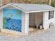 Outbuilding features a unique mural design with ample open space at 307 Little Hickory Ln, Woodstock, GA 30189