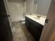 Bathroom featuring a sink, vanity, mirror, and bathtub at 443 Strawberry Walk, Loganville, GA 30052